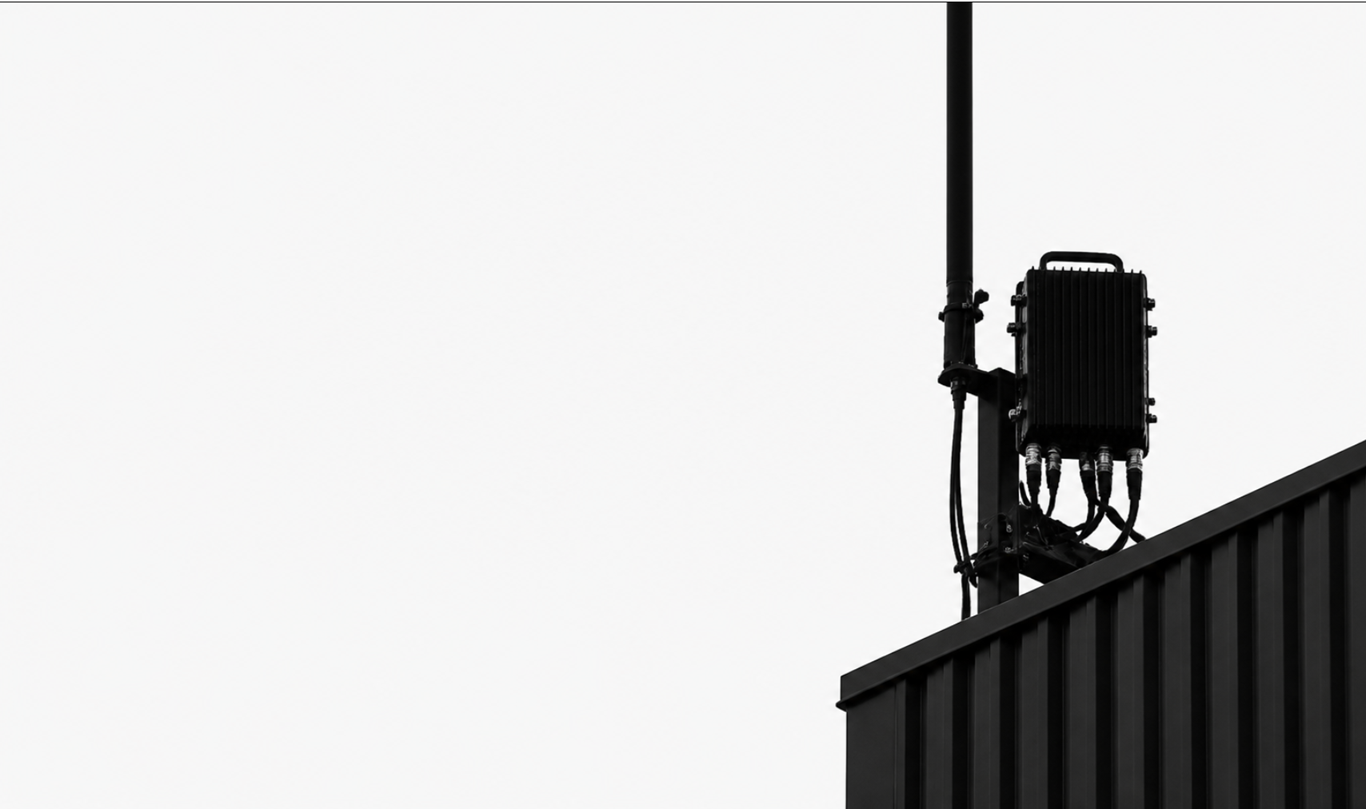 Private LTE remote radio unit mounted on a rooftop pole